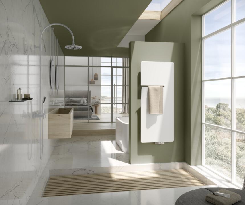 Witte Vasco Ineo elektrische designradiator in moderne badkamer met handdoek